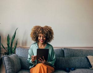 happy person looking at tablet